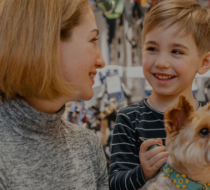 Woman and child with a small dog
